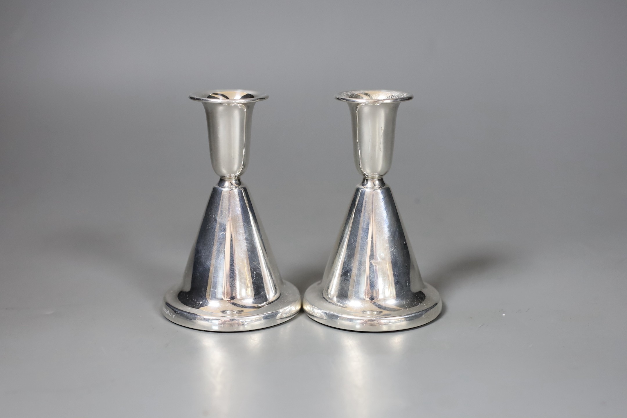 Two pairs of 20th century Scandinavian 830 standard white metal dwarf candlesticks, tallest 10.7cm.